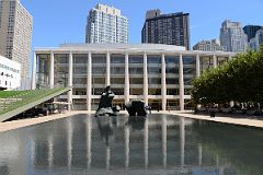 10-2 Reclining Figure By Henry Moore In Paul Milstein Pool With New York Philharmonic David Geffen Hall Behind At Lincoln Center New York City.jpg